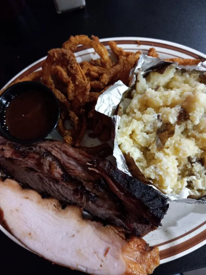 2 Meat Plate with Brisket Turkey Onion Strings and a Baked Potato